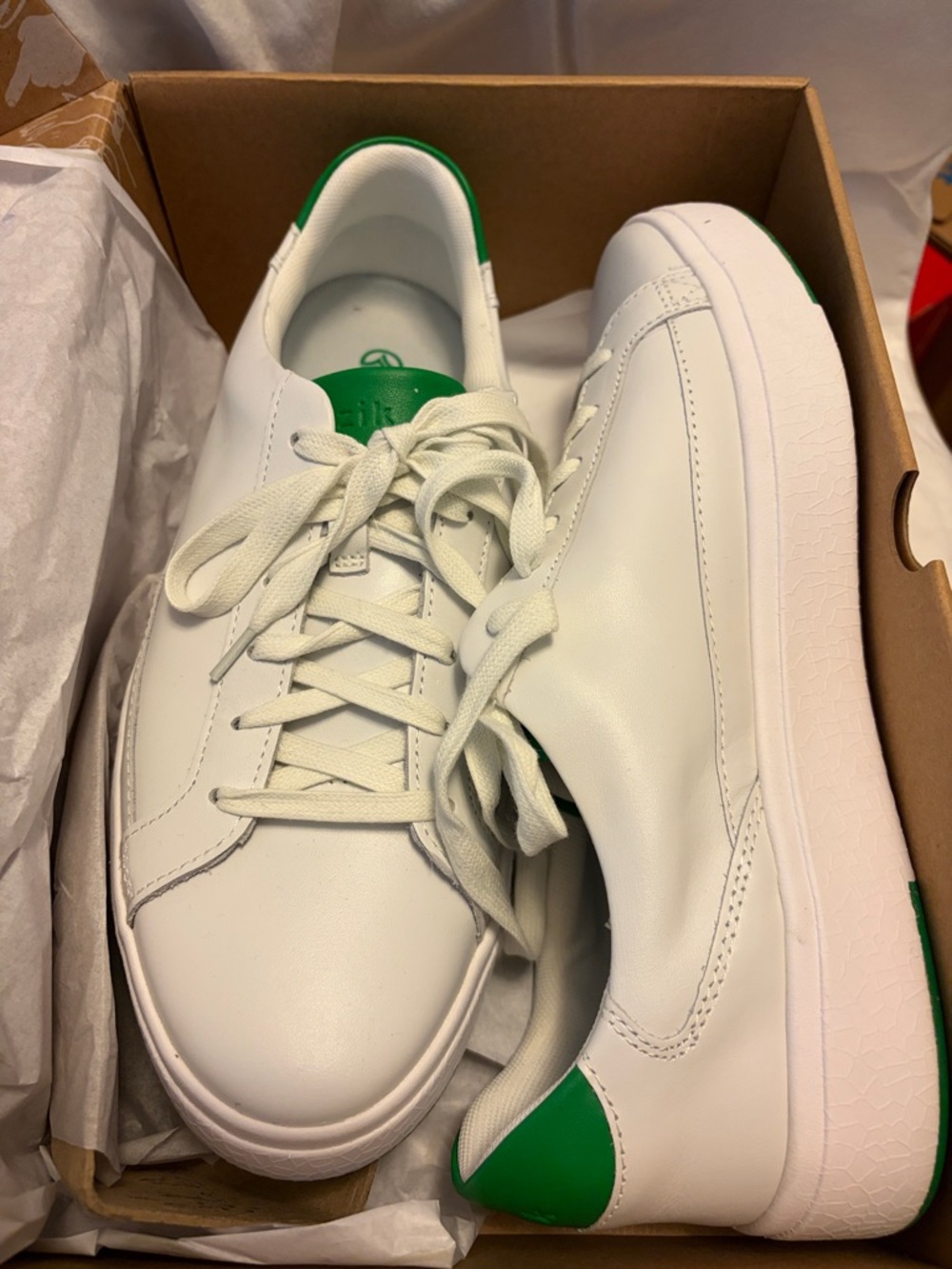 Kizik’s white leather sneakers.
